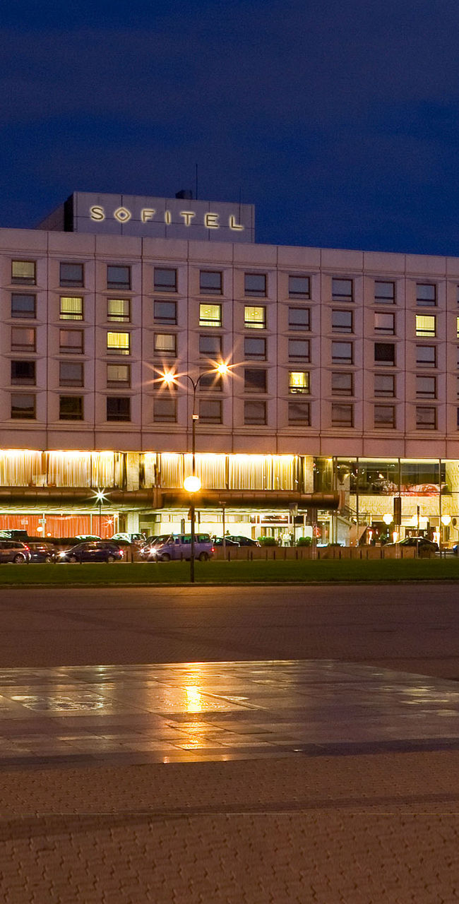Sofitel hotel at night with city lights