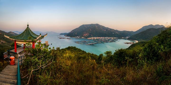 Scenic view of coastal town and mountains