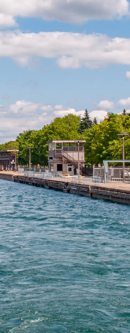 Scenic canal view with industrial backdrop