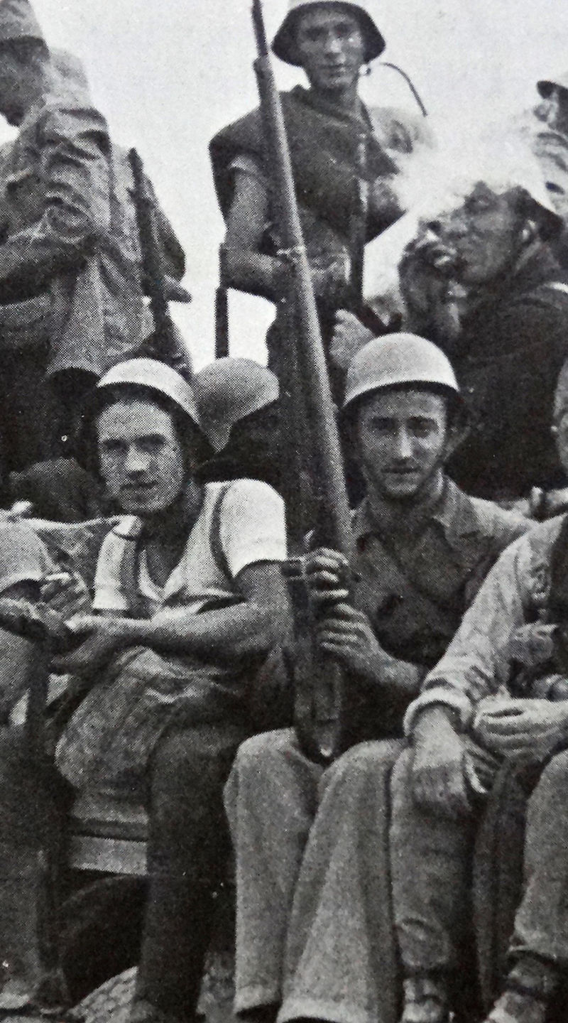 Group of armed soldiers on a truck