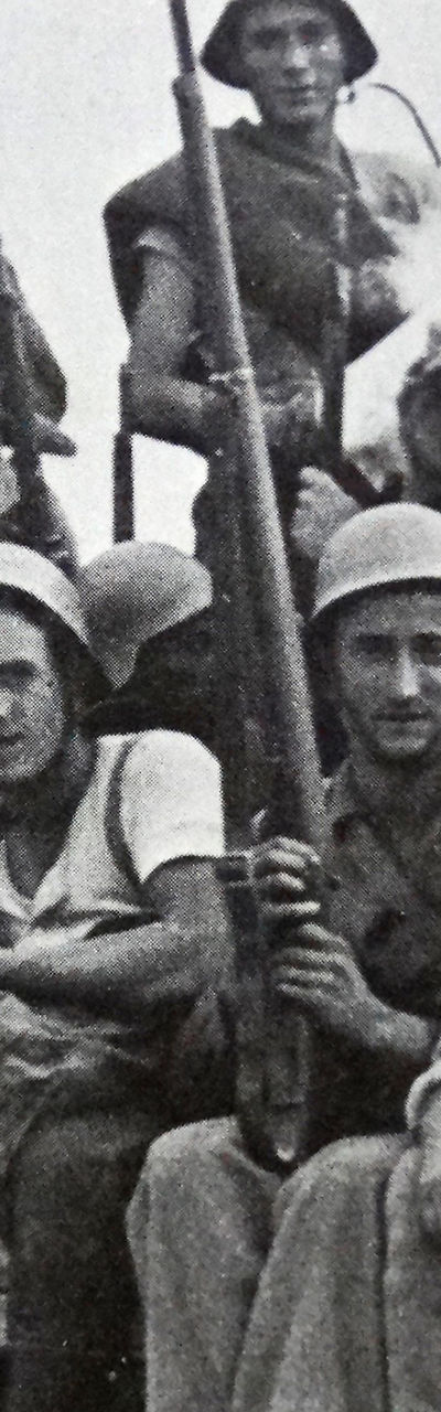 Group of armed soldiers on a truck