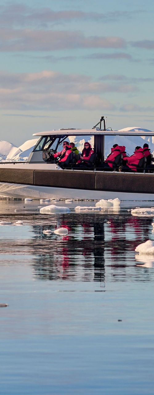 Tour boat navigating icy Arctic waters