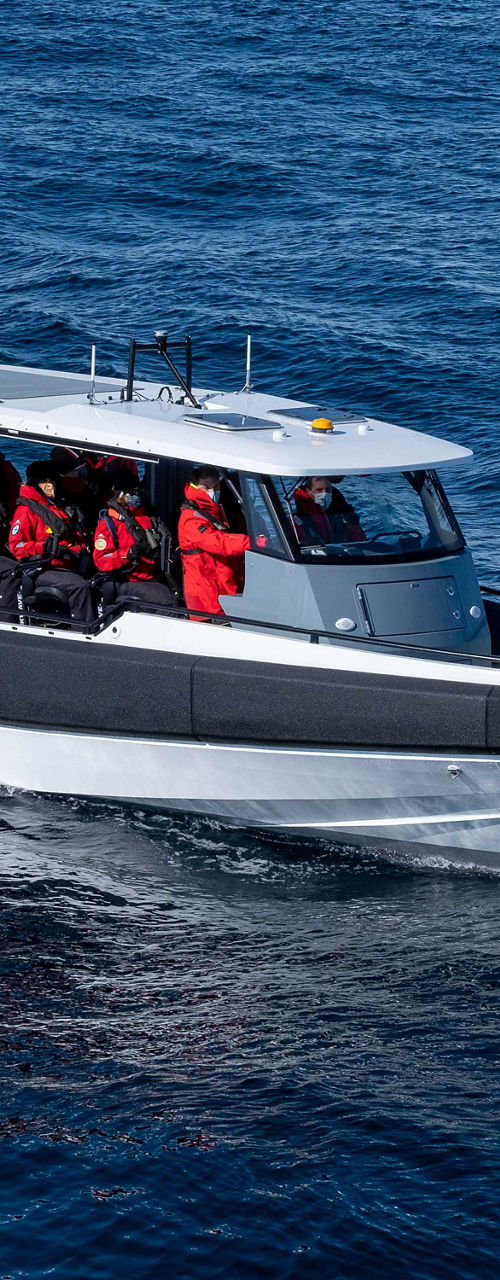 Tour boat with passengers on open water