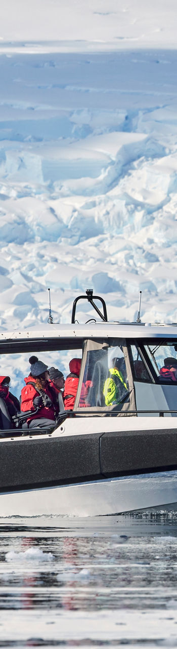 Tour boat navigating icy Antarctic waters