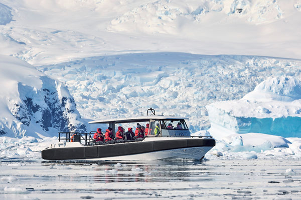 Tour boat navigating icy Antarctic waters