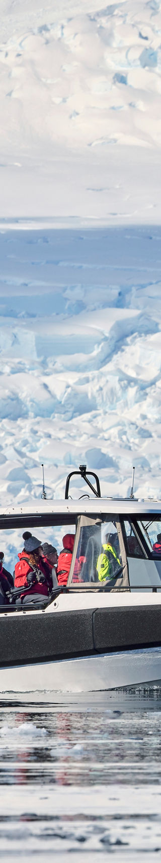 Tour boat navigating icy Antarctic waters