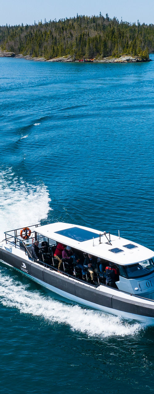 Speedboat cruising on scenic blue lake