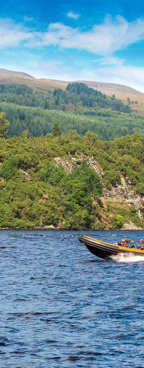 Speedboat cruising on scenic lake