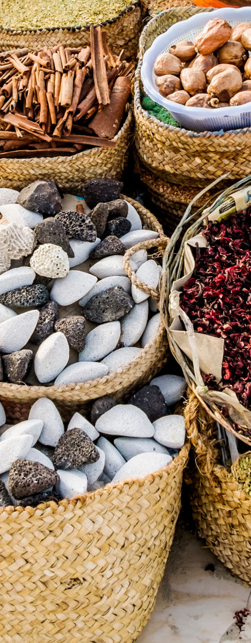 Assorted spices and goods in woven baskets