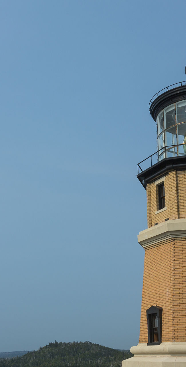 Historic lighthouse overlooking scenic coastline