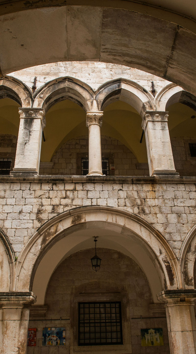 Historic stone courtyard with arches