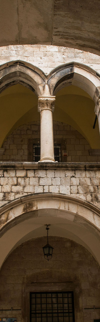 Historic stone courtyard with arches
