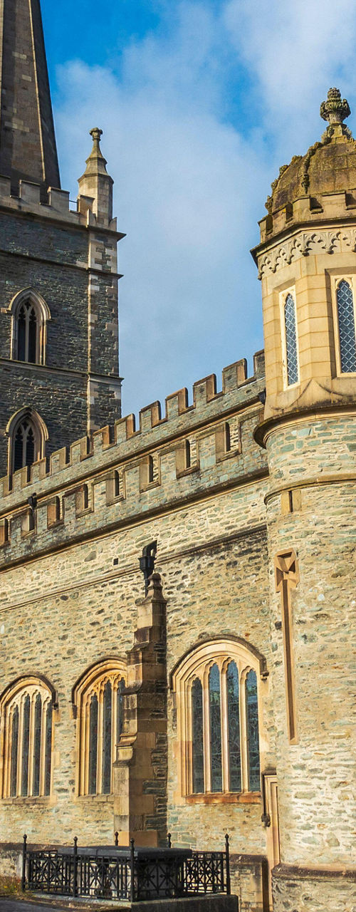 Historic stone church with tall spire