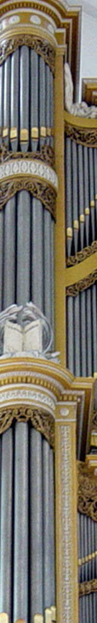 Grand pipe organ in ornate cathedral