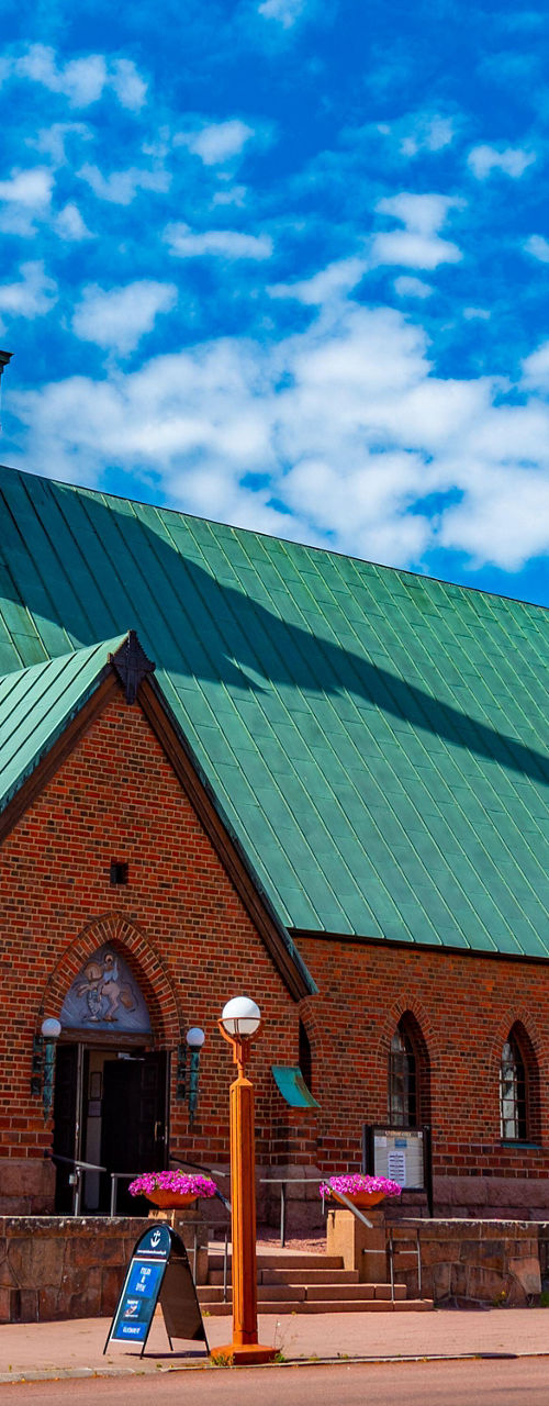 Historic brick church with green roof