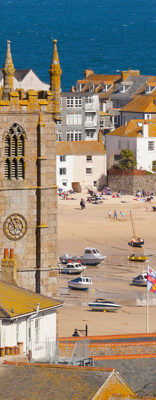 Coastal town with historic church and beach