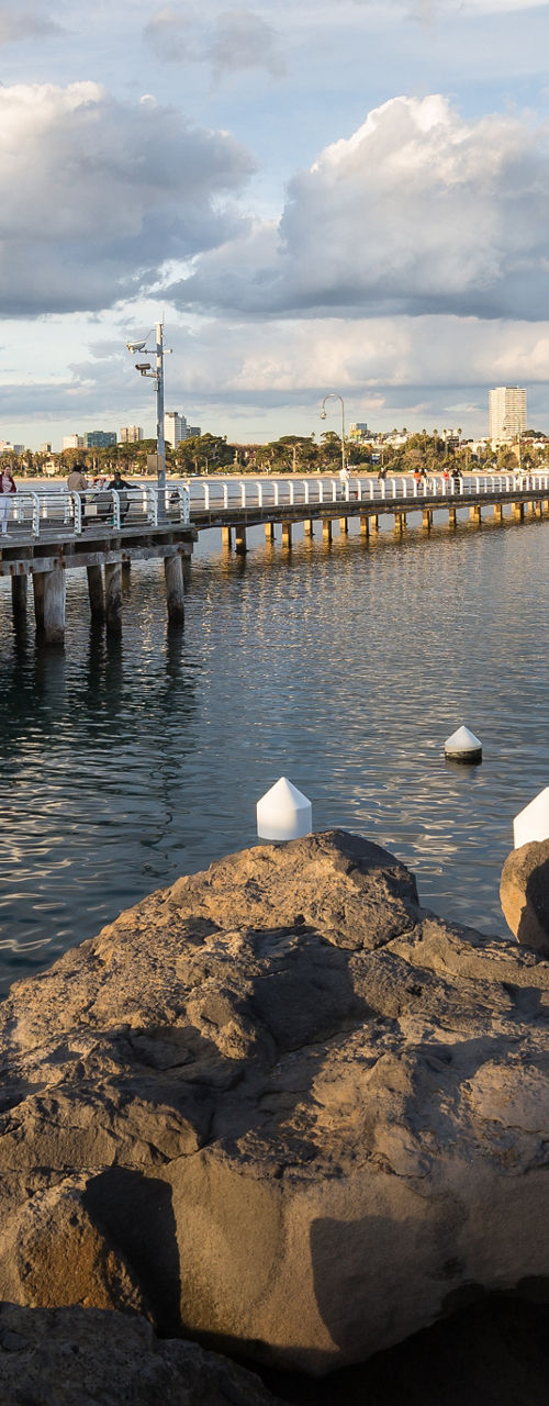 Scenic pier with waterfront view at sunset
