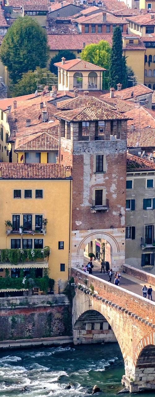 Historic Stone Bridge in Italian Cityscape