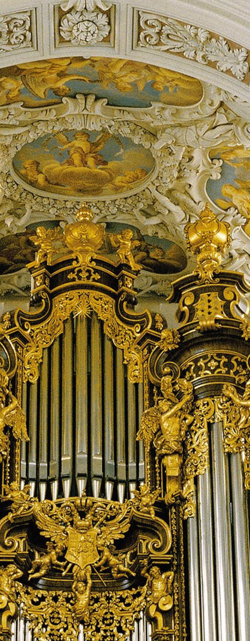 Ornate golden pipe organ in cathedral
