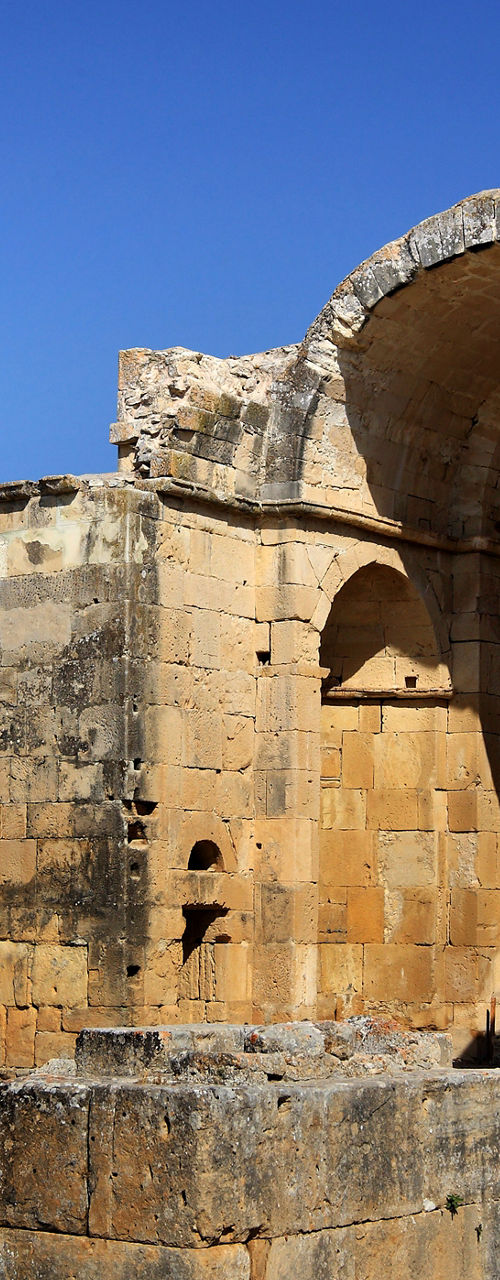 Ancient stone ruins under clear blue sky