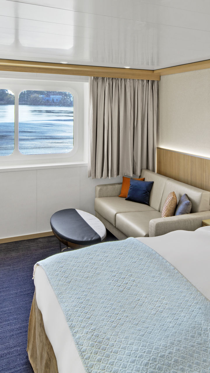 Modern cruise ship cabin with ocean view