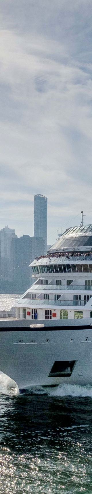 Luxury cruise ship near city skyline