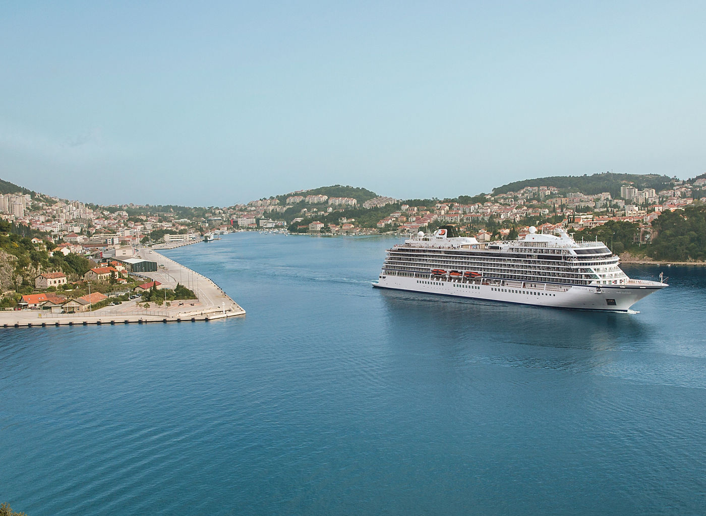 Cruise ship near Dubrovnik bridge and coastline