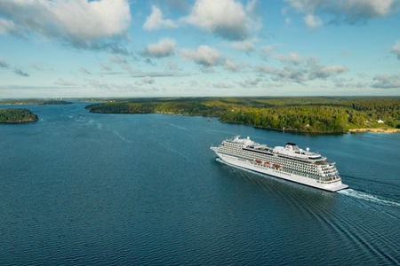 Luxury cruise ship sailing scenic waters