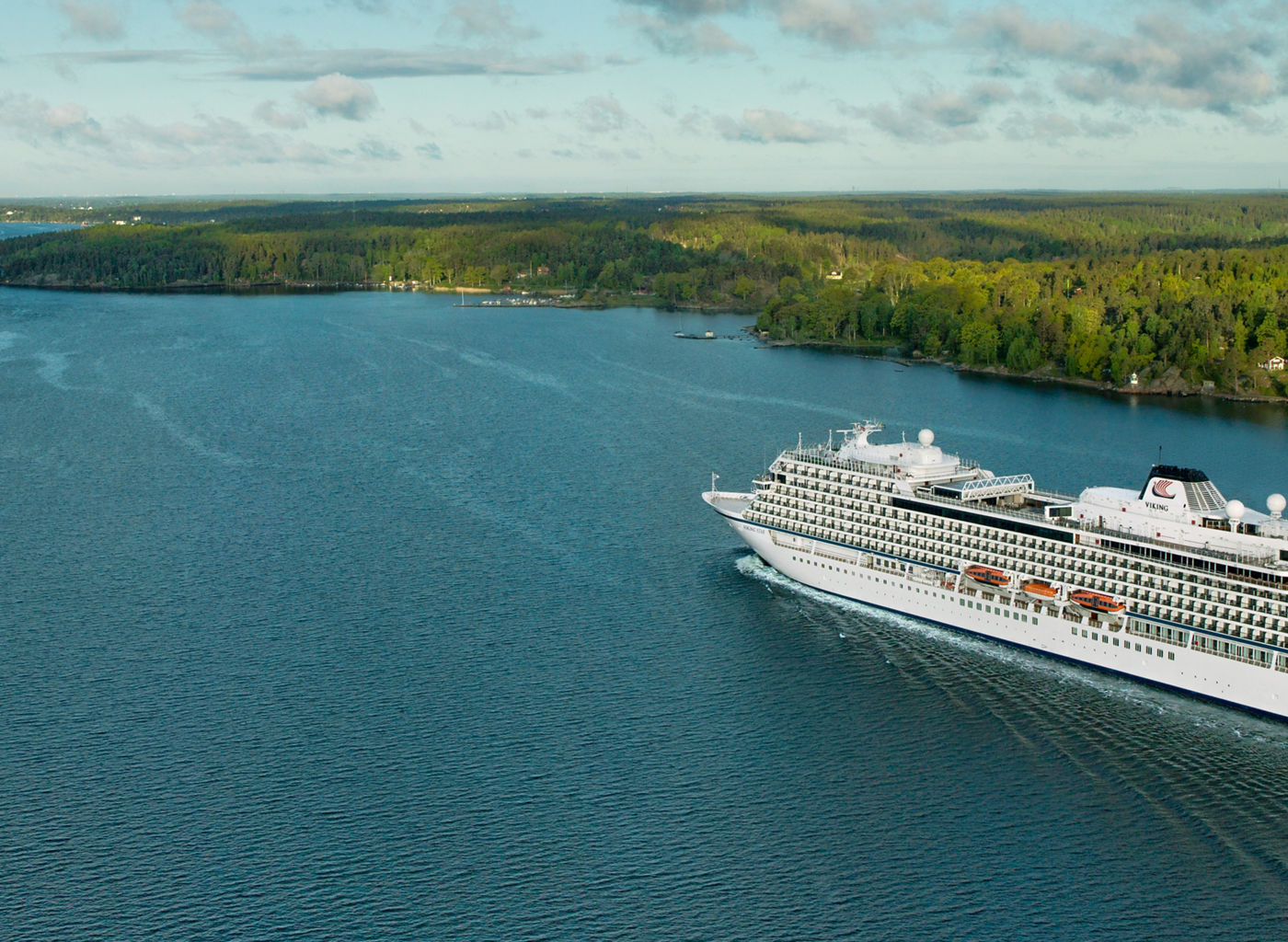 Luxury cruise ship sailing scenic waters