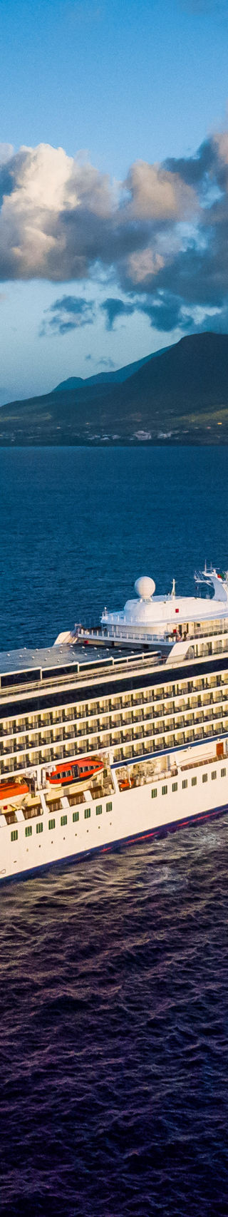 Luxury cruise ship near tropical island