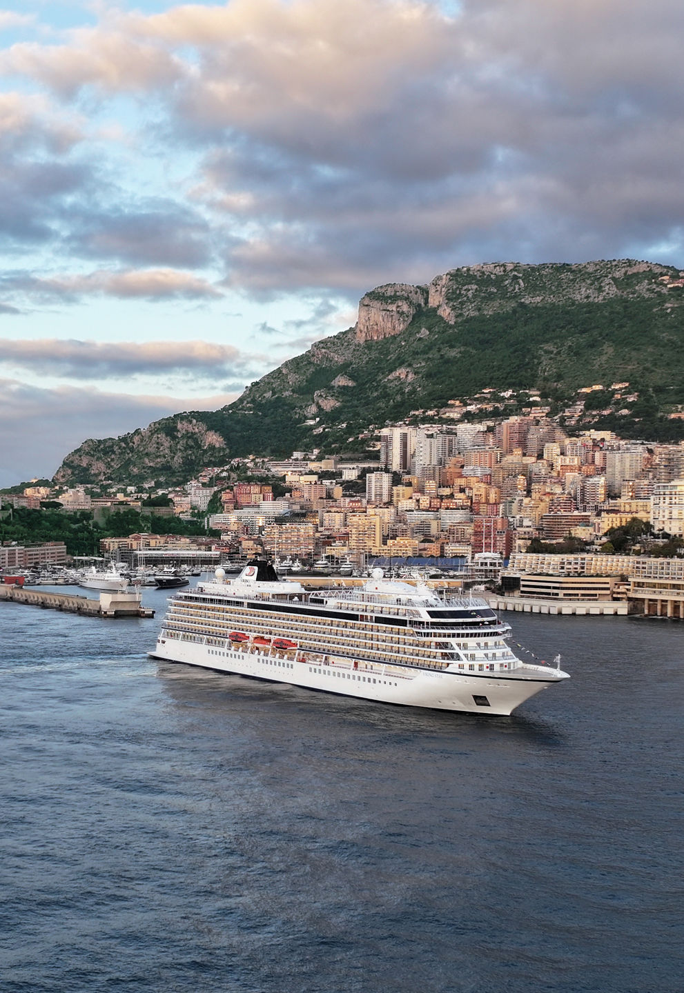 Cruise ship near scenic coastal city