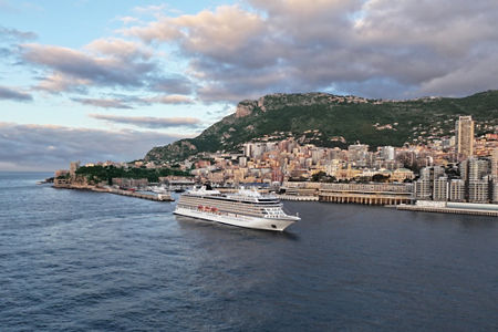 Cruise ship near scenic coastal city