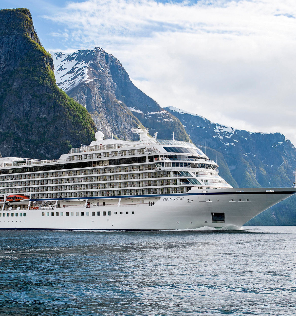 Viking Ocean ship sailing through mountain scenery