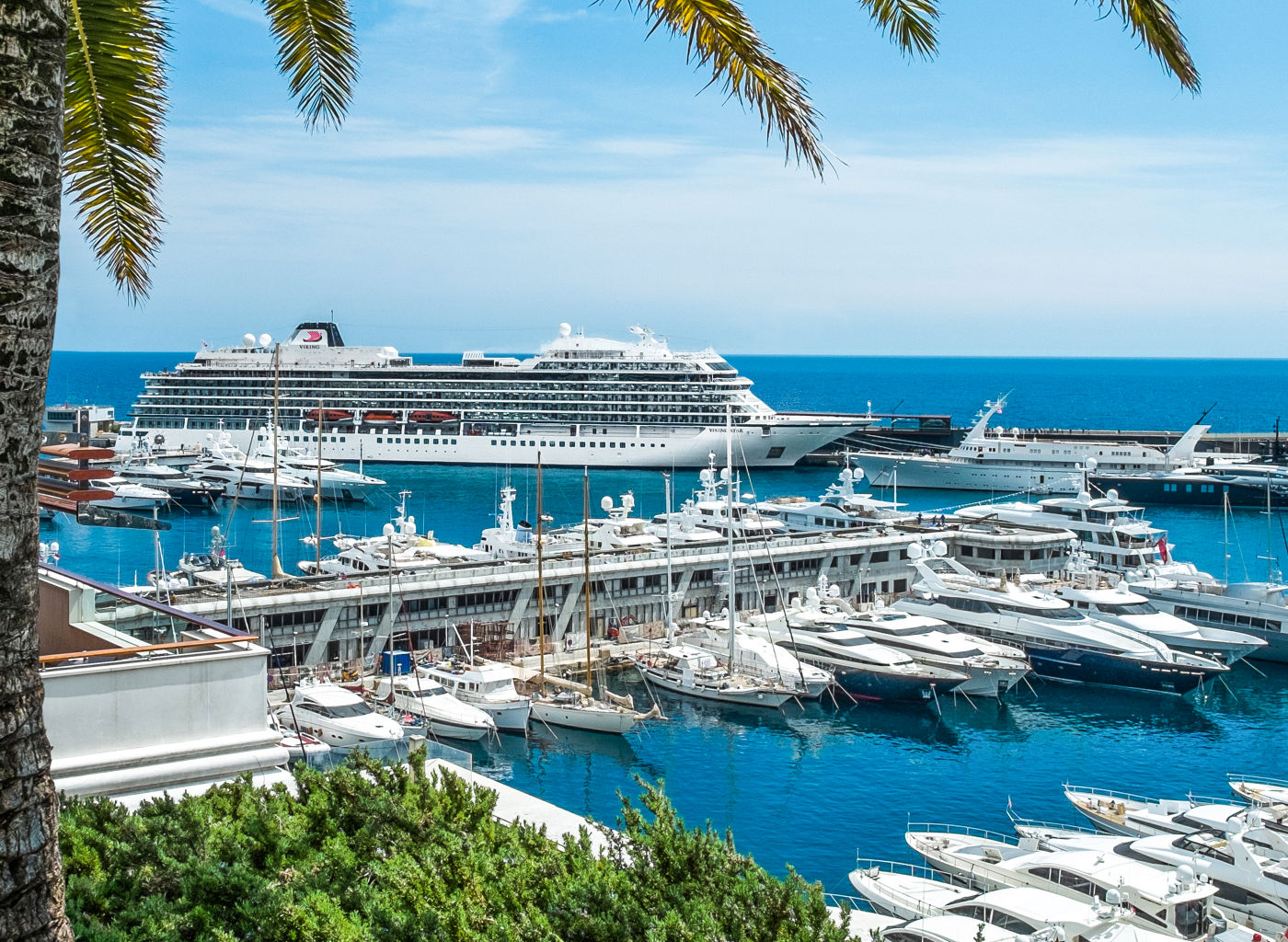Luxury yachts and cruise ship in marina