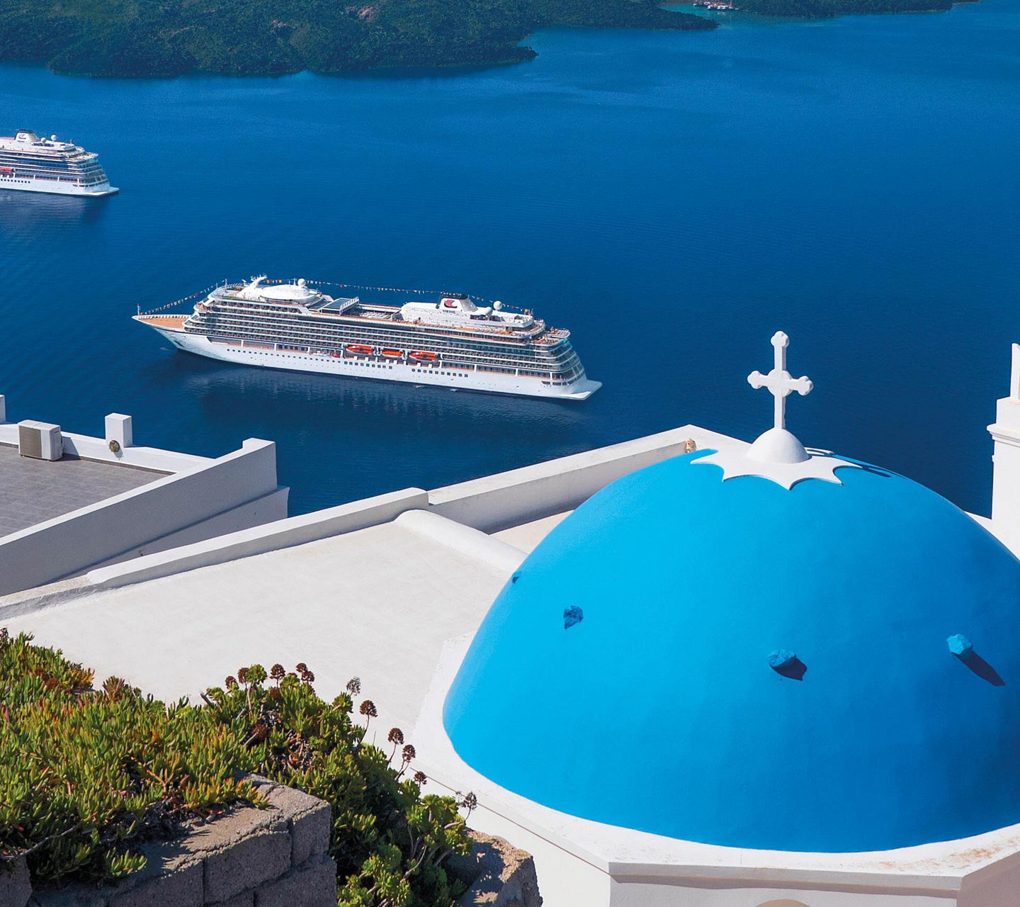 Santorini view with blue dome and sea