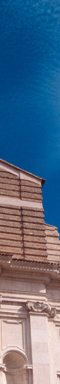 Historic church facade with marble statue