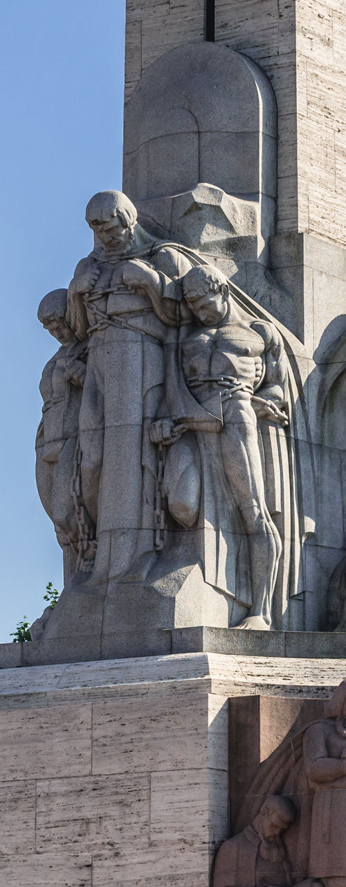 Historic stone monument with sculptures outdoors