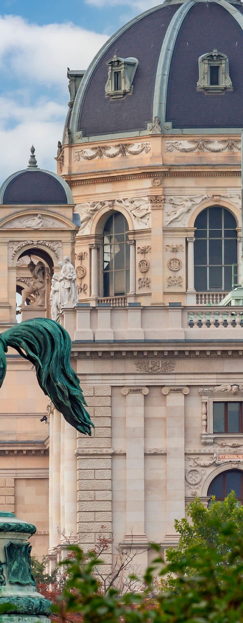 Equestrian statue near historic domed building
