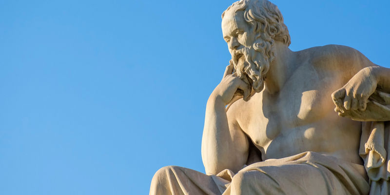Marble philosopher statue against clear sky