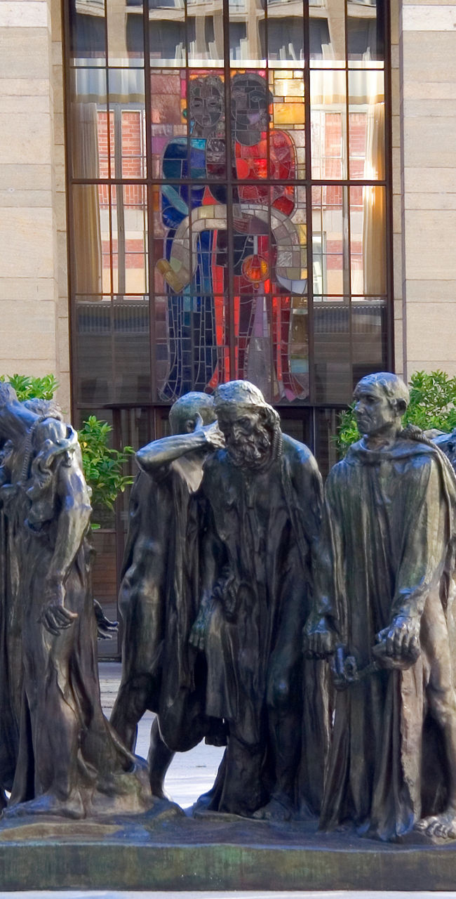 Rodin sculpture in urban courtyard setting