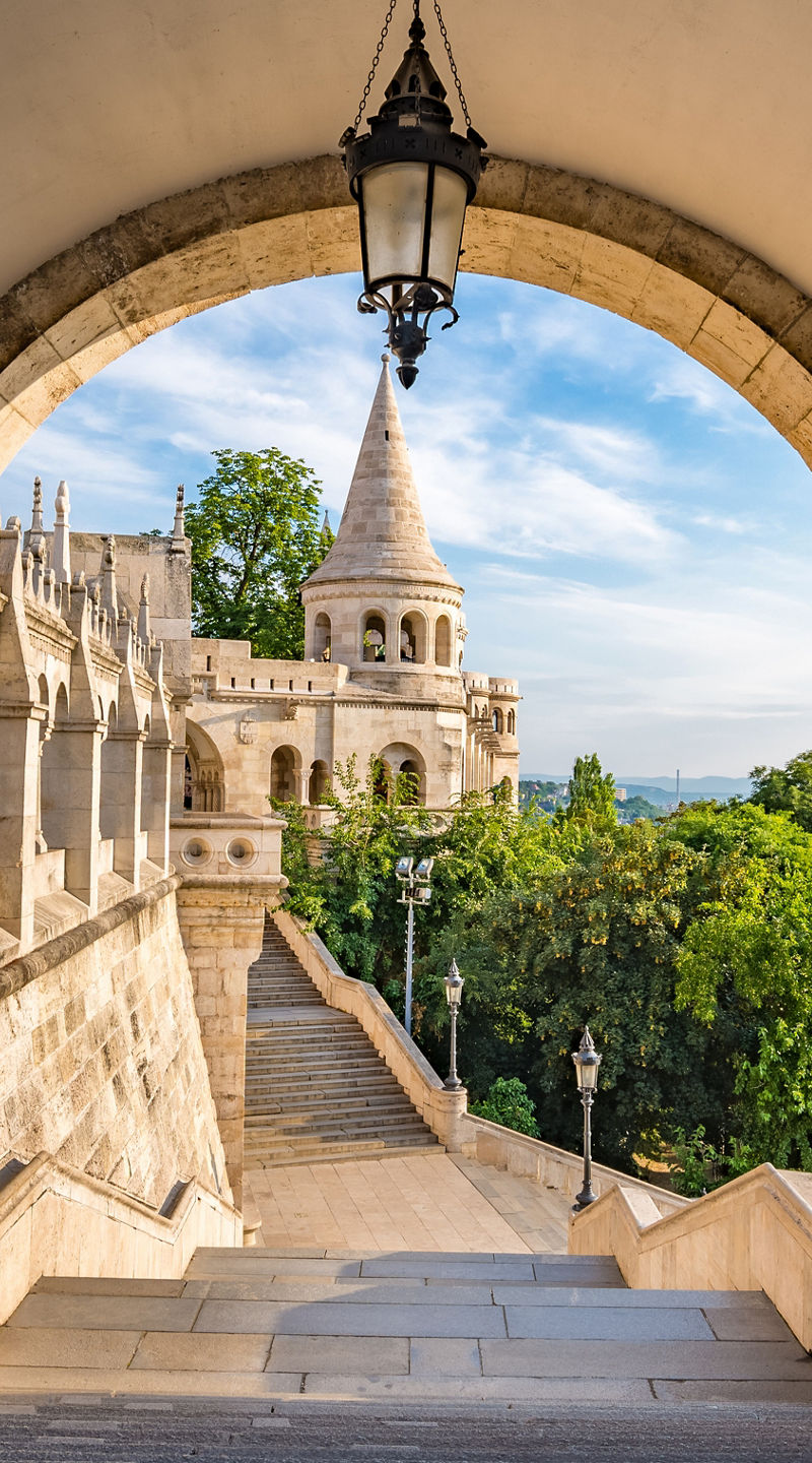 Historic stone archway with scenic view