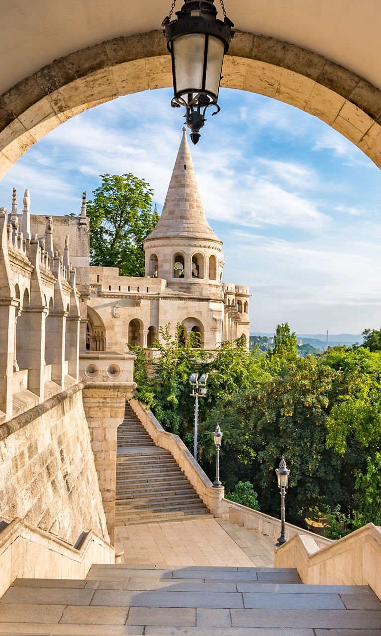Historic stone archway with scenic view
