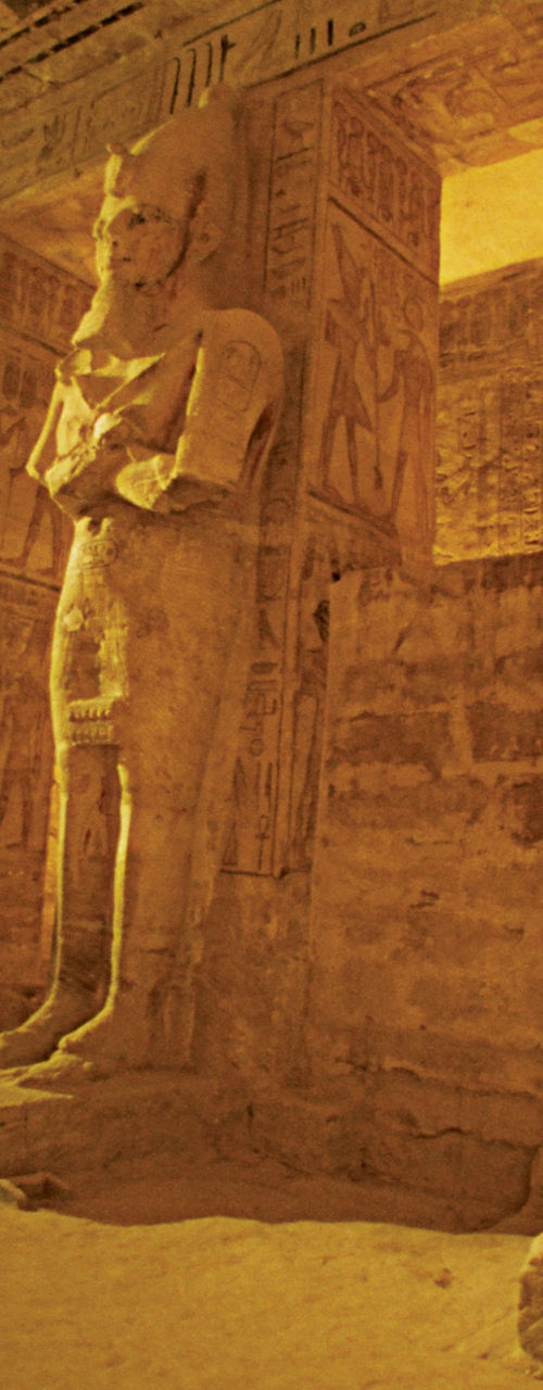Ancient Egyptian statues in temple interior