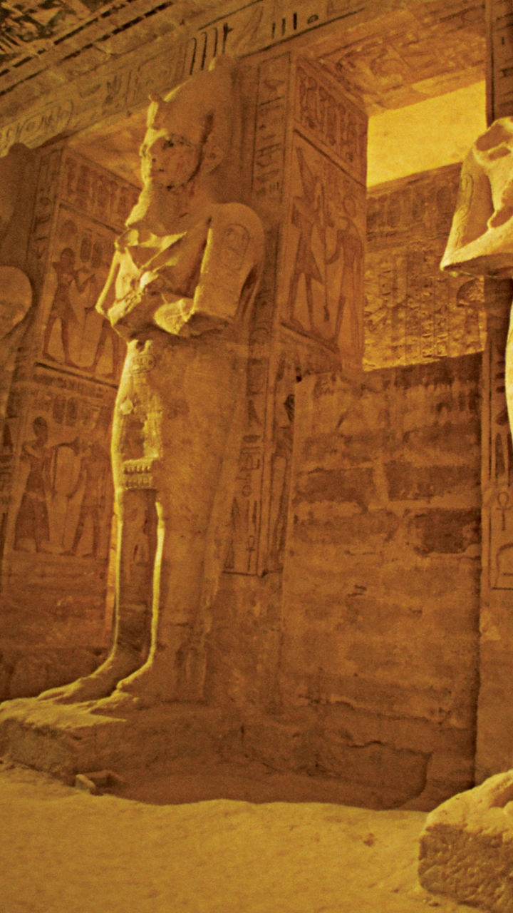 Ancient Egyptian statues in temple interior