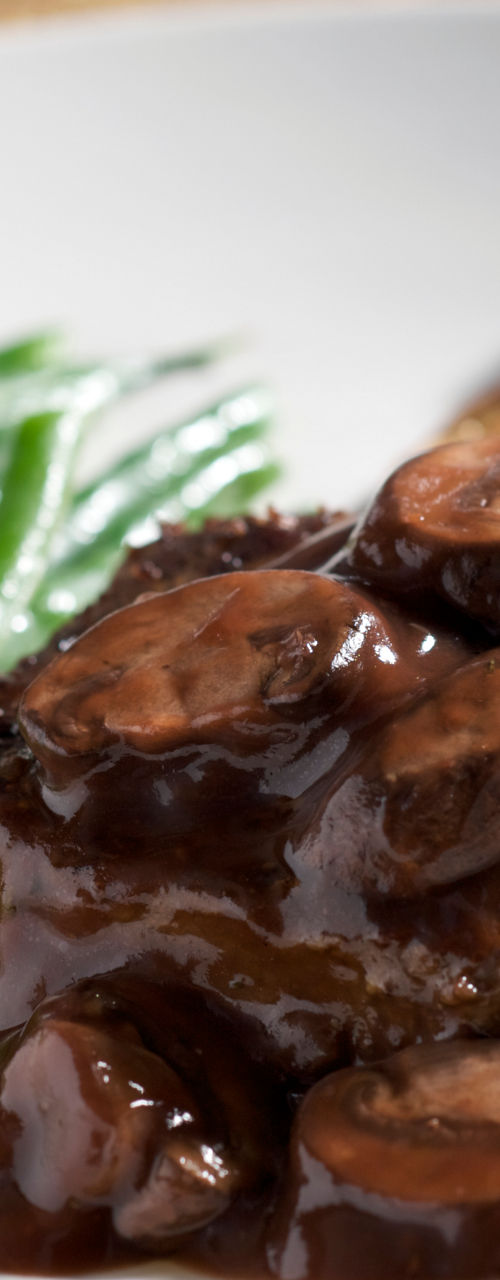 Steak with mushroom sauce and vegetables