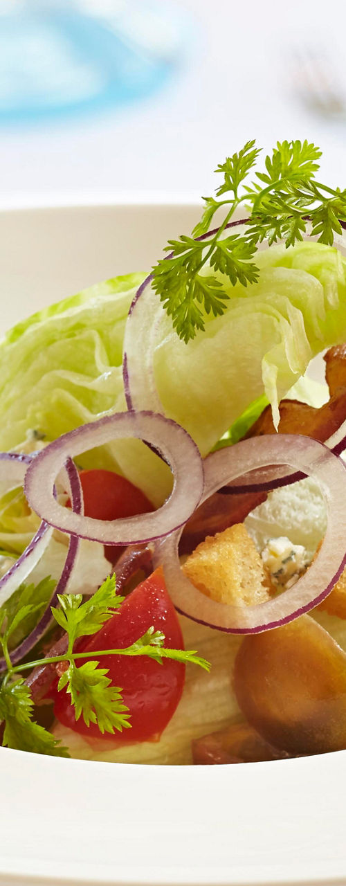 Gourmet salad with wine in fine dining