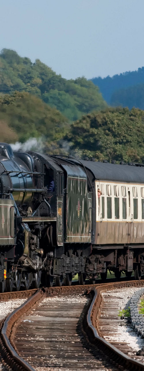 Vintage steam train on countryside tracks