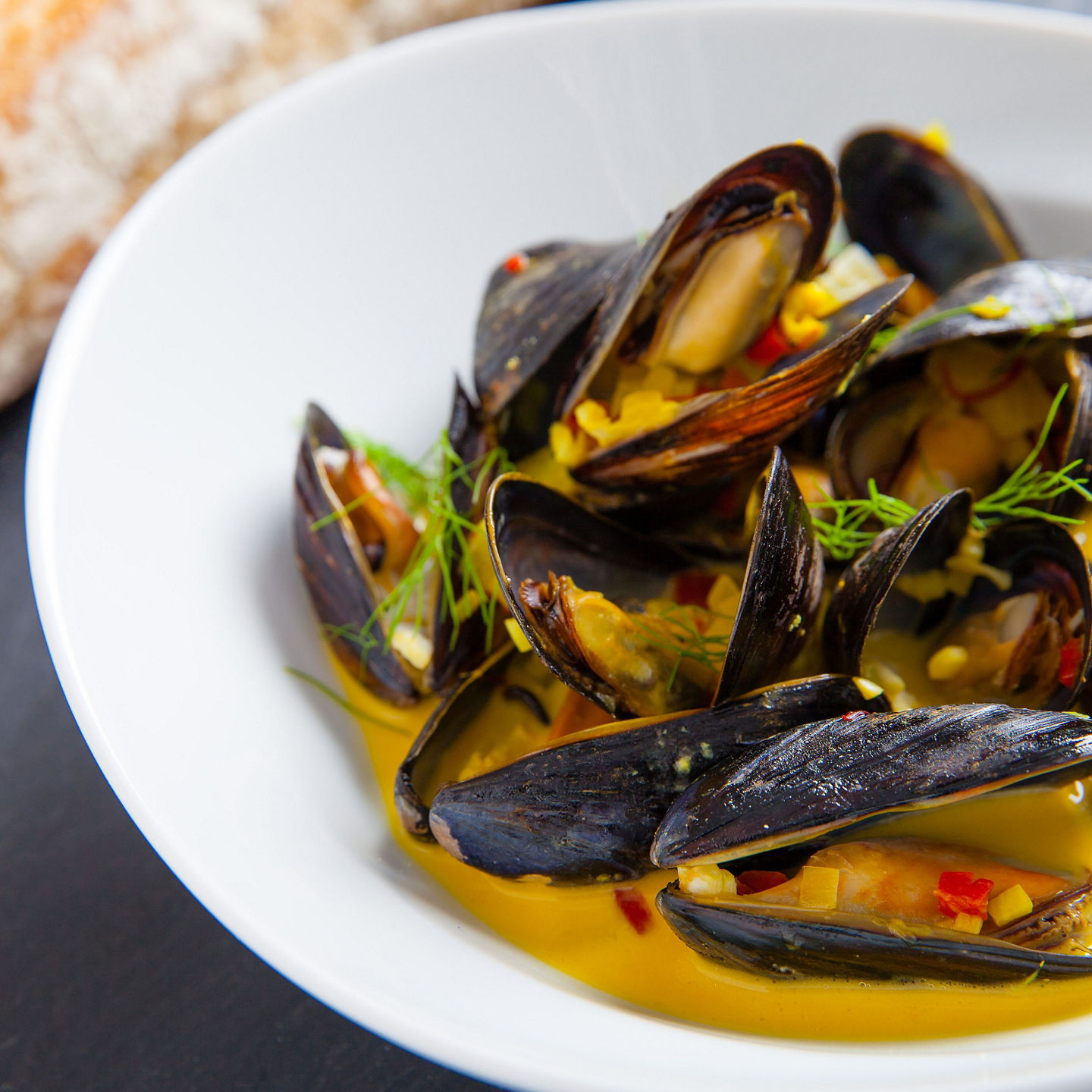 Steamed mussels in creamy saffron sauce