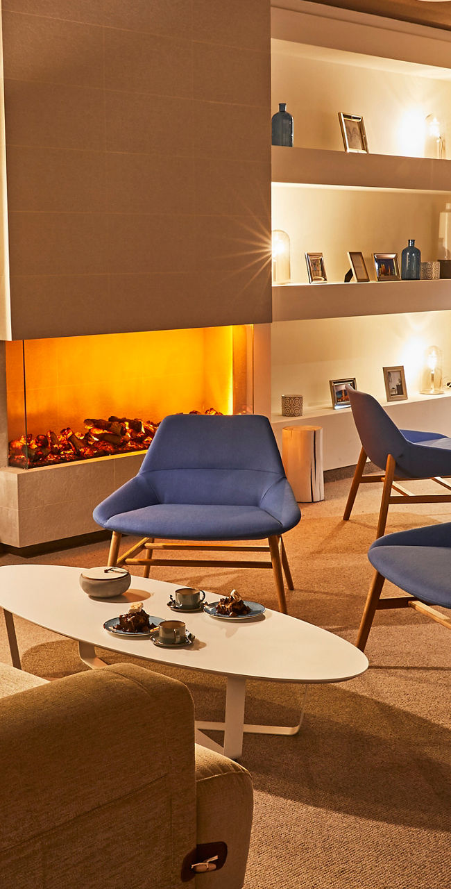 Modern lounge with warm lighting and fireplace