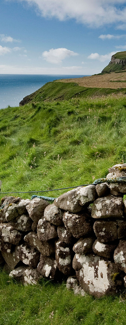Scenic coastal landscape with stone wall